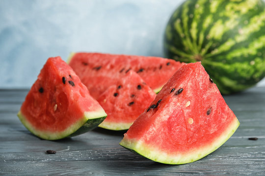 Fresh juicy watermelon with seeds on wooden table