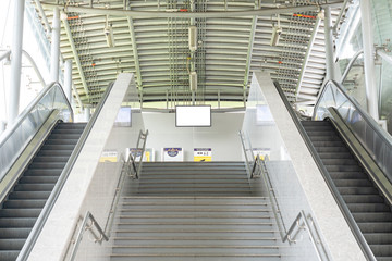 Escalator stairways to underground train station