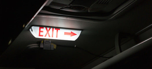 Glowing Exit Sign Symbol with Red Arrow