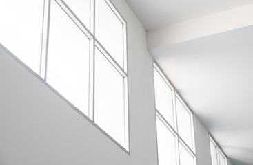 Large Windows and sunlight in the empty white room
