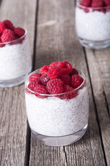 Chia pudding in glass with raspberry