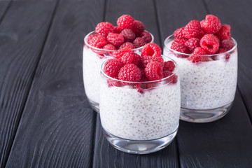 Chia pudding in glass with raspberry