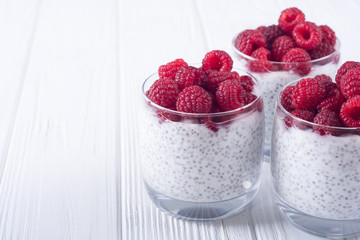 Chia pudding in glass with raspberry