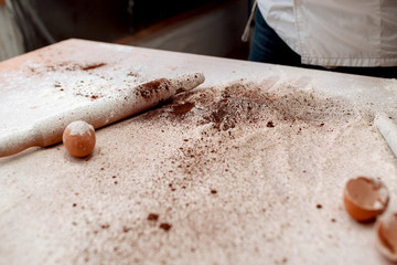 Table of the chef with rolling pin and products