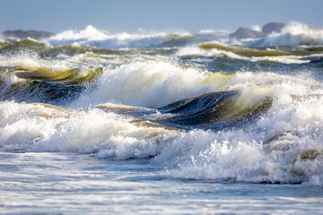 Yellow tinted waves breaking on the Oregon coast.