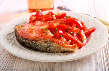 Red fish steak, grilled and salad