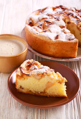 Apple cake with icing sugar on top, served