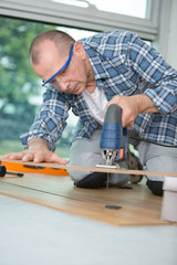 carpenter working with cutting tool