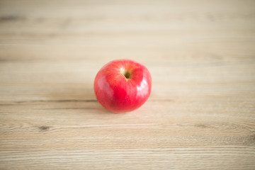 red apple lies on a table