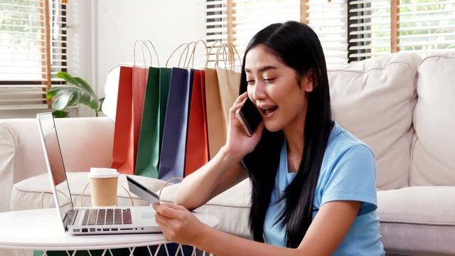 Asian woman using smartphone for register credit card at home. People with shopping concept. 4k resolution.