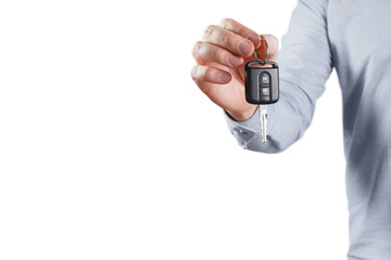 Fototapeta premium Male hand holding car key, isolated on white background