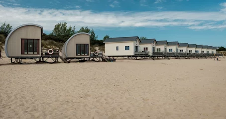 Foto op Plexiglas anti-reflex Row of Holiday houses on the beach of Zeeland in Holland. © Erik_AJV