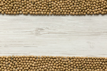 Dried chickpeas on white background, top view. Copy space.