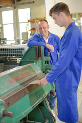 student of the vocational school is working with mentor