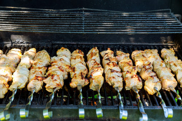Grilling shashlik on barbecue grill. Selective focus