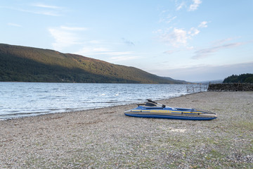 Inflatable Boat Abandoned By The Lakeside.