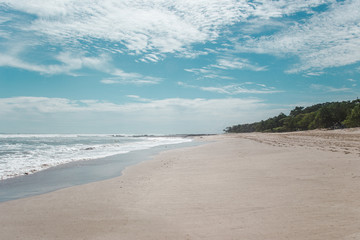Beautiful paradise white sand beach of Playa Carmen, near Santa Teresa on the Nicoya peninsula of Costa Rica