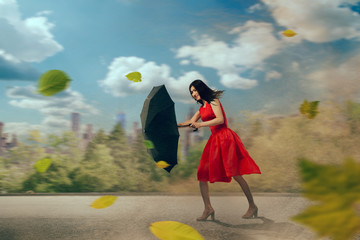Woman in red dress with umbrella, hurricane