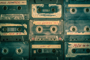 Collection of retro audio tapes on wooden table