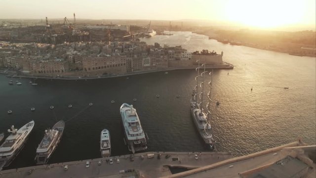 High Aerial Shot over a European City during Sunset