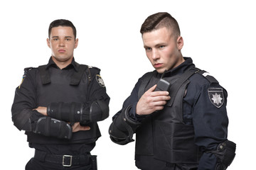 Cops in uniform and body armor on white background