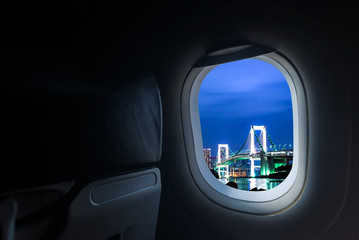 Naklejka premium windows porthole in aircraft see Beautiful destination travel