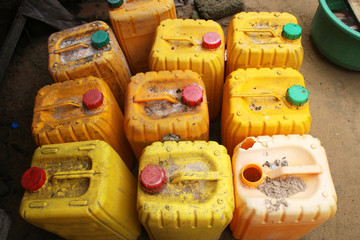 Old used chemical plastic canisters