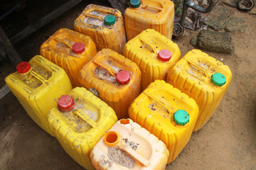 Old used chemical plastic canisters