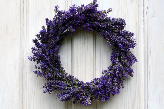 Lavender wreath on an old white wooden door. - Powered by Adobe
