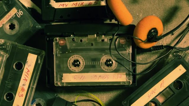 Spinning audio tape in a player and some ancient cassettes