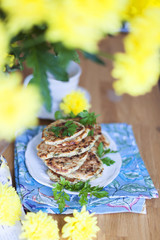 pancakes for breakfast. view from the window. vase with yellow flowers,