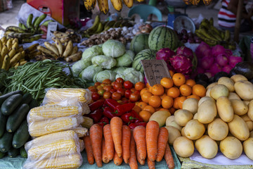 Dumaguete, the Philippines - 27 July 2018: Fruit and vegetable on local market store. Summer harvest vegetable and fruit.
