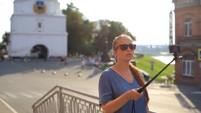 woman blogger shoots video on action camera for his blog on social networks.