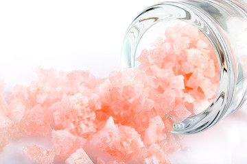 Crystals of pink salt of Lake Sivash. Isolated on white background.