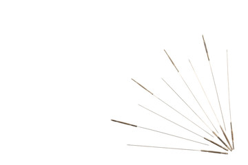 Silver needles for traditional Chinese medicine acupuncture. Close-up. Isolated on white background.