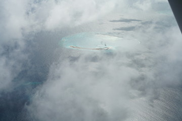 Obraz na płótnie Canvas Aerial view from a seaplane in The Maldives