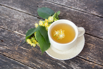 linden flowers, herbal medicine, Cup of healthy tea with honey and lemon. alternative or complementary medicine, traditional medicine. soft focus image