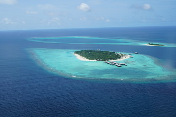 Naklejka na ściany i meble Aerial view from a seaplane in The Maldives