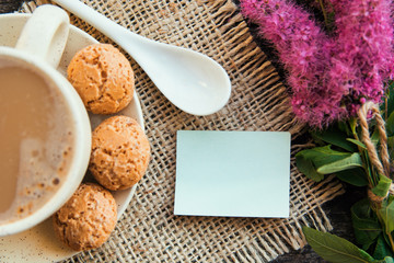 cup of coffee and bouquet of flowers decoration. sunny morning breakfast, place for lovely message 