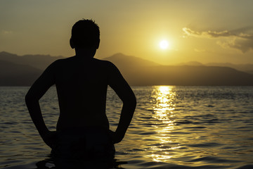 Silhouette of child on the beach