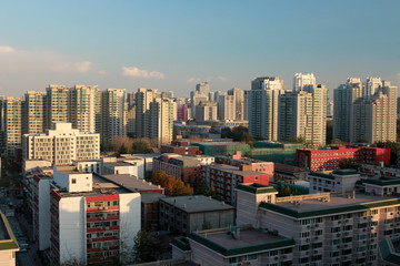 Residential and Commercial buildings in Dongzhimen, Beijing China. Miscellaneous city skyscrapers, color image. Cluster of tall buildings in the heart of the city. Densely populated Chinese City