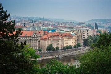 Fototapeta na wymiar Cityscape of the center of Prague (Czech Republic) with Vltava river on a summer day
