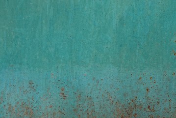 green metallic texture on an old wall with rust