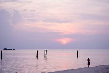 Fototapeta premium Beautiful of sunrise with colorful sky in summer time concept travel, holiday and vacation. Tropical paradise beach nature landscape at Lipe island in Thailand.