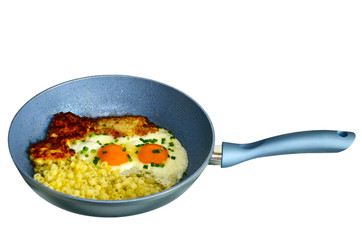 Eggs in a frying pan with bacon. The bachelor's breakfast.