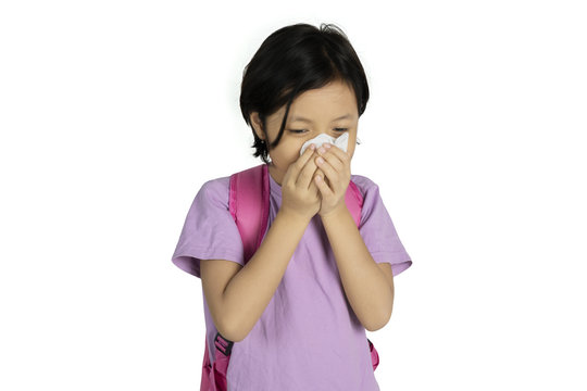 Asian Schoolgirl Wiping Her Nose With A Tissue