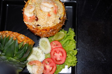 bake rice with pineapple in pineapple shell
