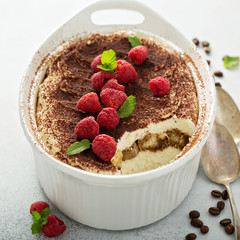 Tiramisu cake in a ceramic dish