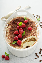 Tiramisu cake in a ceramic dish