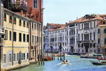 Venice canal and boat traffic - famous place, Veneto, Italy; attraction, sightseeing, vacations, travel, romance, tourism.